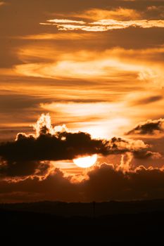 Mesmerizing sunset in Malappuram with vibrant golden clouds and radiant sky.