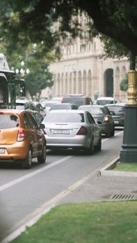 Urban traffic jam with cars and buses on the streets of Baku, Azerbaijan.