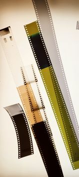 Artistic display of various film negatives in a vertical arrangement.