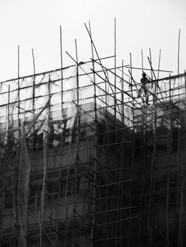 Bamboo scaffolding on a building under construction in Hong Kong.
