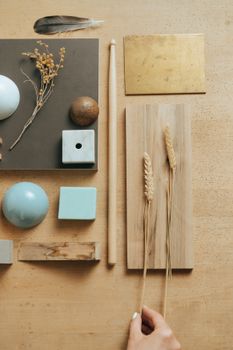 Creative flat lay of various objects and textures on a wooden surface.